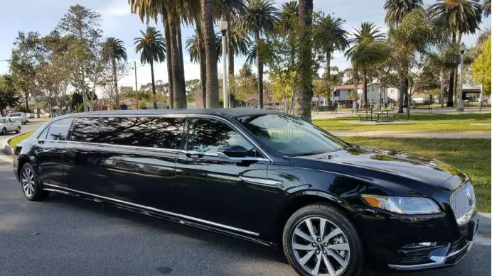 a black car parked on the side of the road