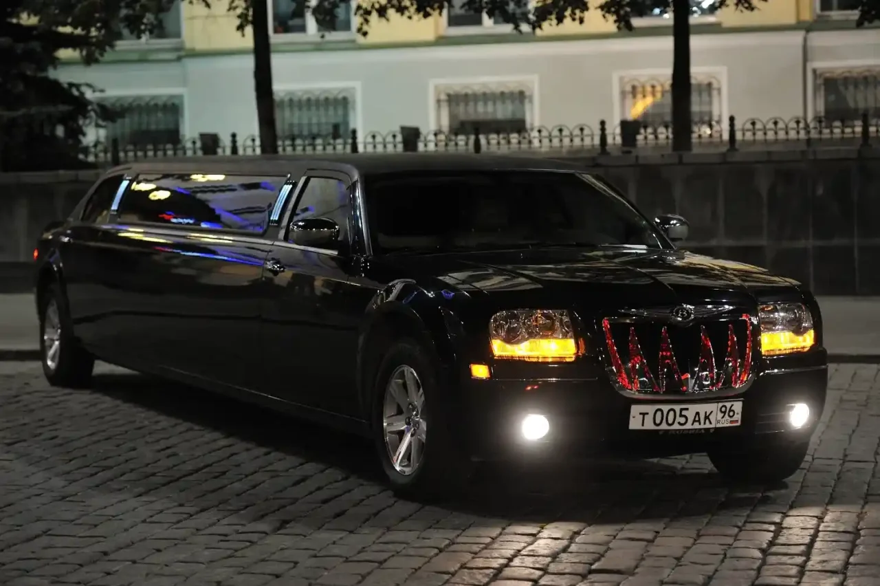 Hiring a Limo Service  a black limousine parked on a brick road