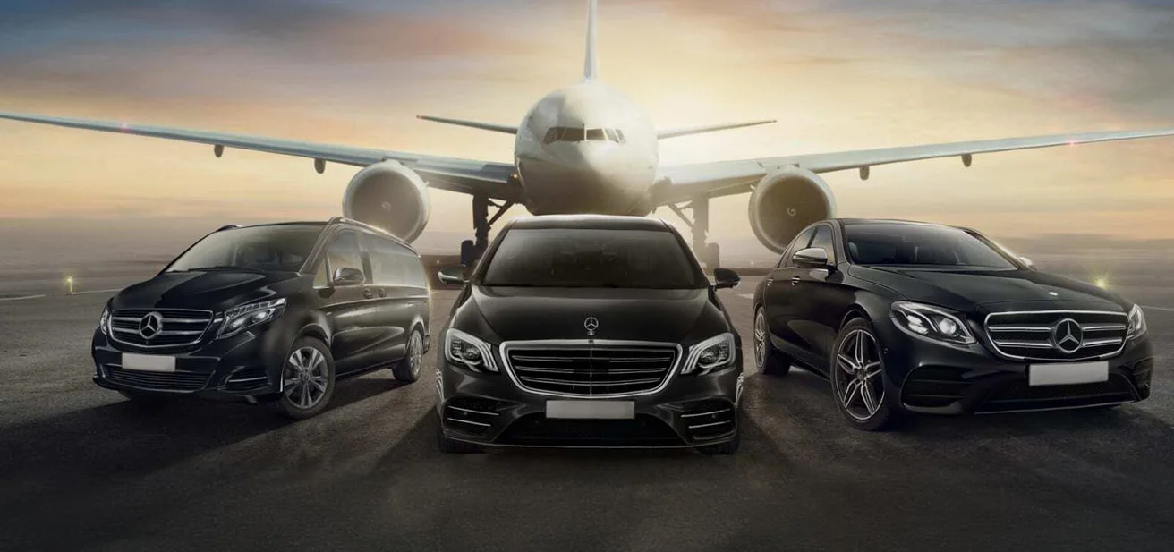 Limo transportation a group of cars parked in front of an airplane