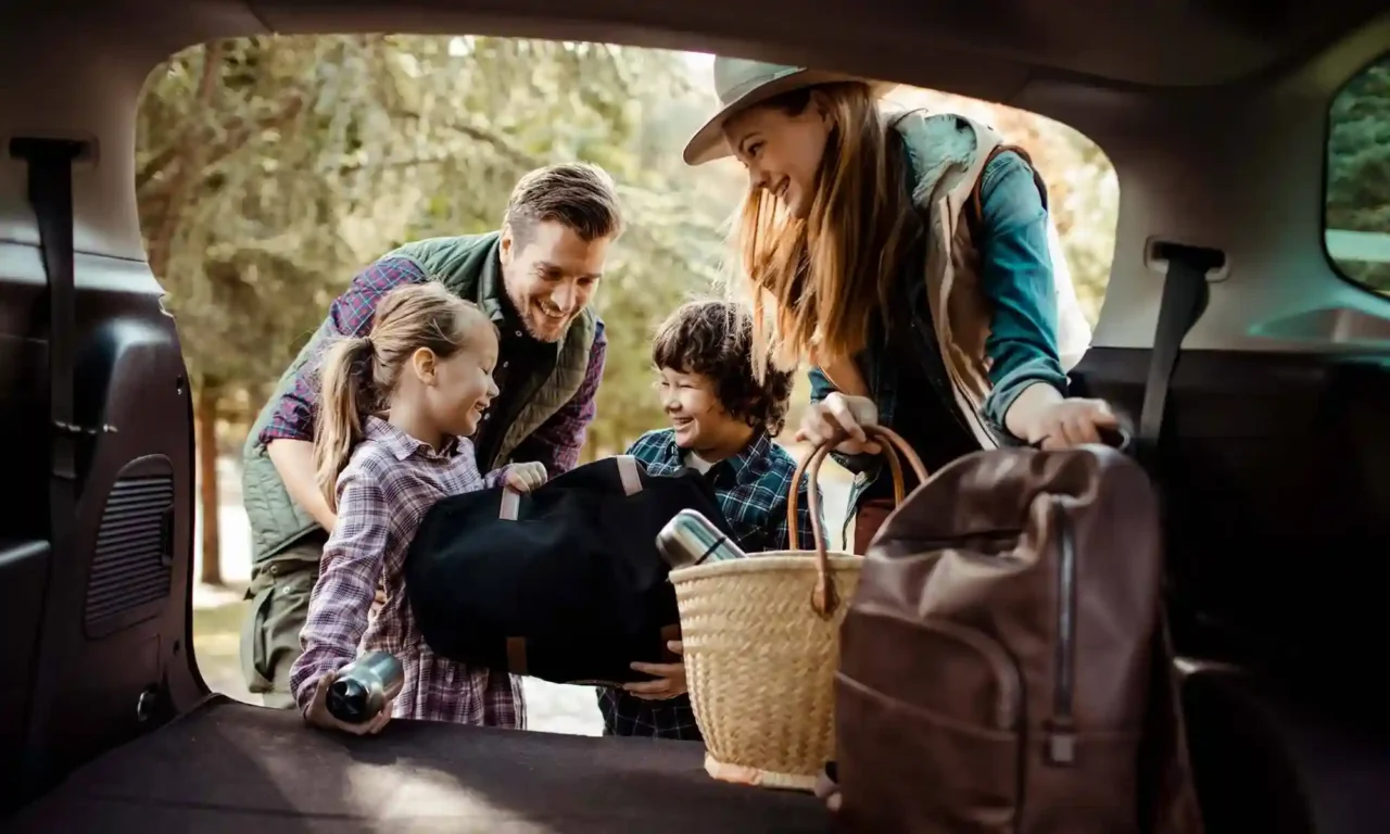 a group of people sitting in the back of a car