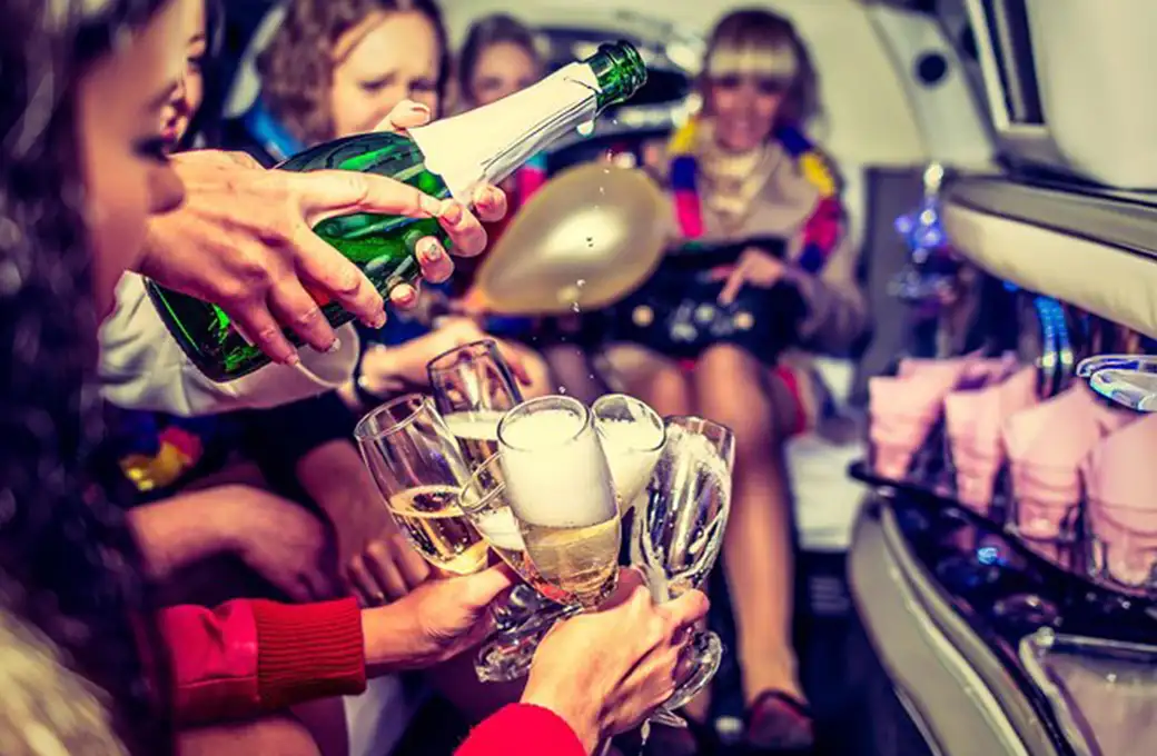 a group of people toasting with champagne. limo service in New York.