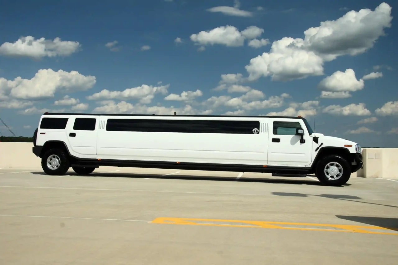 Jeep Limousine   a white limo is parked in a parking lot