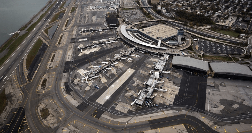 car service from laguardia to manhattan an aerial view of an airport with a body of water in the background