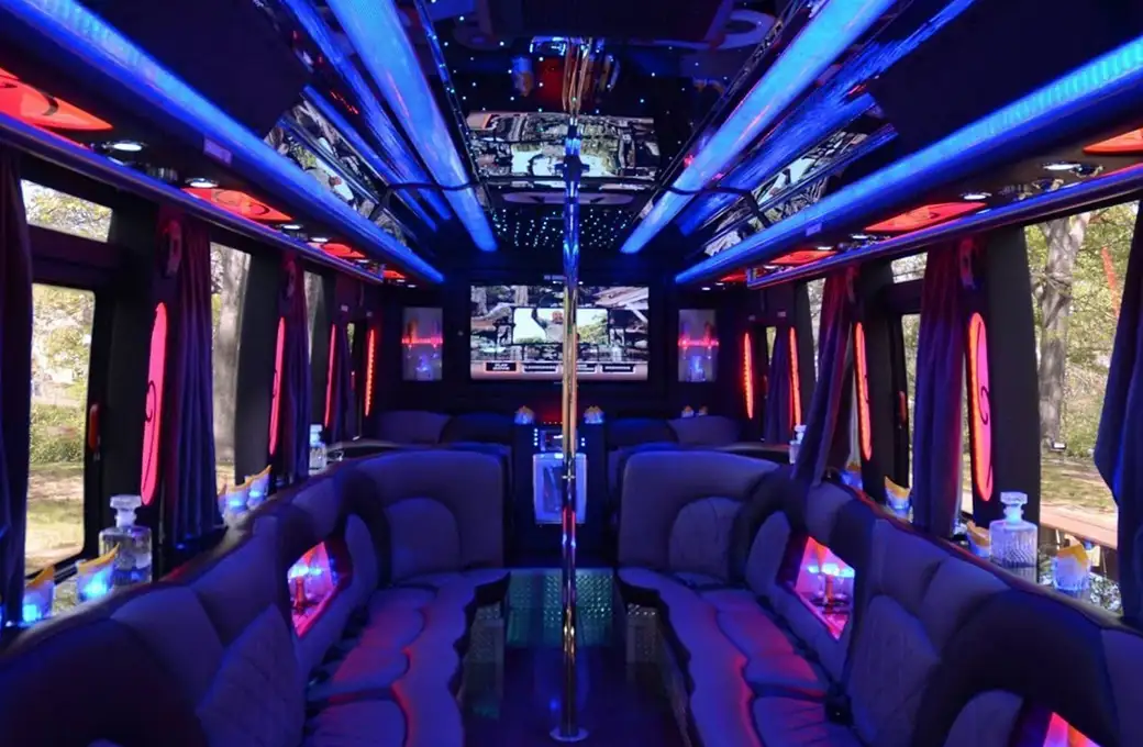 the inside of a party bus with couches and tables. limo service in New York.